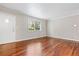 Bright bedroom featuring hardwood floors, neutral paint, and a large window at 2412 Peachwood Circle Northeast Ne Cir # 3, Atlanta, GA 30345