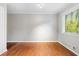 Sunlit bedroom with hardwood floors, a large window, and neutral wall paint at 2412 Peachwood Circle Northeast Ne Cir # 3, Atlanta, GA 30345