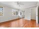 Bedroom featuring hardwood floors, mirrored closet doors and ample sunlight at 2412 Peachwood Circle Northeast Ne Cir # 3, Atlanta, GA 30345