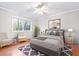 Bright bedroom with hardwood floors, ceiling fan, and ample natural light, complete with tasteful decor at 2412 Peachwood Circle Northeast Ne Cir # 3, Atlanta, GA 30345