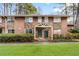 Charming brick and stone townhouse with covered entrance and well-maintained landscaping at 2412 Peachwood Circle Northeast Ne Cir # 3, Atlanta, GA 30345