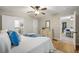 Bedroom featuring wood floors, a ceiling fan, and ensuite bathroom at 2485 Brentwood Rd, Decatur, GA 30032