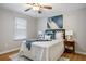 Bedroom with a ceiling fan, neutral walls, and wood floors at 2485 Brentwood Rd, Decatur, GA 30032