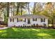Charming single-story home featuring a well-manicured lawn, fresh landscaping, and a welcoming entrance at 2485 Brentwood Rd, Decatur, GA 30032