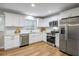 Beautiful bright kitchen with white cabinets, subway tile backsplash, and stainless steel appliances at 2485 Brentwood Rd, Decatur, GA 30032