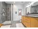 Modern bathroom with a glass-enclosed shower, tiled walls, and a vanity with ample storage space at 3235 Roswell Ne Rd # 919, Atlanta, GA 30305