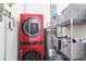 Laundry room area featuring a new washer and dryer, hot water heater and shelving at 3235 Roswell Ne Rd # 919, Atlanta, GA 30305