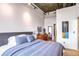 Inviting bedroom with a large bed, stylish decor, hard wood floors and large windows for plenty of natural light at 3235 Roswell Ne Rd # 919, Atlanta, GA 30305