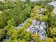 A wide aerial view of the property, showing its position amidst lush greenery at 301 Abercorn Sq, Peachtree City, GA 30269