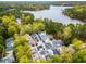 Aerial shot of properties near the lake and lush greenery at 301 Abercorn Sq, Peachtree City, GA 30269