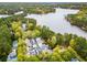 Panoramic aerial showcasing the property's setting near a scenic lake and surrounding trees at 301 Abercorn Sq, Peachtree City, GA 30269