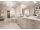 Luxury bathroom featuring a soaking tub, vanity, mirrors, and a walk-in shower at 301 Abercorn Sq, Peachtree City, GA 30269