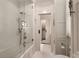 Modern bathroom featuring a glass-enclosed shower, tiled walls, and elegant fixtures at 301 Abercorn Sq, Peachtree City, GA 30269