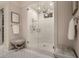Elegant bathroom with glass shower, seating area, and neutral color palette at 301 Abercorn Sq, Peachtree City, GA 30269