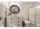 Chic bathroom featuring a vanity with marble countertop and a glass-enclosed shower at 301 Abercorn Sq, Peachtree City, GA 30269