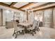 Dining area features a wood table, upholstered chairs, tile floors and exposed wooden beams at 301 Abercorn Sq, Peachtree City, GA 30269