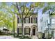 Elegant home exterior with dark shutters, beautiful landscaping, and inviting front entrance at 301 Abercorn Sq, Peachtree City, GA 30269