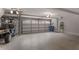 Spacious two-car garage with plenty of room for vehicles and storage, plus golf cart at 301 Abercorn Sq, Peachtree City, GA 30269