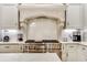 Modern kitchen featuring stainless steel appliances, sleek countertops, and custom cabinetry at 301 Abercorn Sq, Peachtree City, GA 30269
