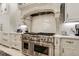 Gourmet kitchen featuring stainless steel appliances, custom cabinetry, and a subway tile backsplash at 301 Abercorn Sq, Peachtree City, GA 30269