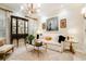 Cozy living room with designer lighting, plush seating, and elegant decor at 301 Abercorn Sq, Peachtree City, GA 30269