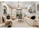 Elegant living room with designer furnishings, large windows, and sophisticated decor at 301 Abercorn Sq, Peachtree City, GA 30269