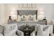 Spacious main bedroom featuring sitting area, plush bedding, and designer accents at 301 Abercorn Sq, Peachtree City, GA 30269