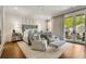 Inviting main bedroom features private balcony, plush seating, and natural light at 301 Abercorn Sq, Peachtree City, GA 30269