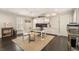 Well-lit home office featuring hardwood floors, built-in cabinets, and a large desk at 301 Abercorn Sq, Peachtree City, GA 30269