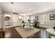 Well-lit home office featuring hardwood floors, built-in cabinets, and a large desk at 301 Abercorn Sq, Peachtree City, GA 30269