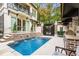 Stunning pool and outdoor kitchen area with stone counters and stainless steel grill at 301 Abercorn Sq, Peachtree City, GA 30269