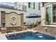 A serene pool area with a decorative water fountain, creating a tranquil atmosphere for relaxation and enjoyment at 301 Abercorn Sq, Peachtree City, GA 30269
