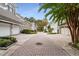 A street view of the property with a paved driveway, and neatly trimmed landscaping at 301 Abercorn Sq, Peachtree City, GA 30269