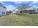 Backyard with an established tree and a wooden privacy fence at 312 Jodeco Station E Cir, Stockbridge, GA 30281