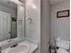 Neutral toned bathroom includes a commode and a sink at 312 Jodeco Station E Cir, Stockbridge, GA 30281
