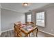 Dining room has two windows, a table, and six chairs at 312 Jodeco Station E Cir, Stockbridge, GA 30281