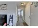 Light filled hallway featuring modern gray walls and wood laminate flooring throughout at 312 Jodeco Station E Cir, Stockbridge, GA 30281