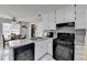 Kitchen with black gas range and an eat-in dining area at 312 Jodeco Station E Cir, Stockbridge, GA 30281
