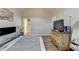 Bright main bedroom featuring wood floors, neutral paint, and doorway to the bathroom at 312 Jodeco Station E Cir, Stockbridge, GA 30281