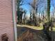 Backyard with a concrete patio leading to a sloped yard at 1255 North Nw Ave, Atlanta, GA 30318