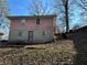 Back elevation of brick home with basement entry and yard at 1255 North Nw Ave, Atlanta, GA 30318