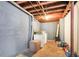 Unfinished basement area with laundry hookups and painted walls at 1255 North Nw Ave, Atlanta, GA 30318