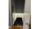 Basement stairs leading to an unfinished basement with lighting at 1255 North Nw Ave, Atlanta, GA 30318
