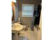 Bathroom featuring a pedestal sink, tiled floor, and a shower/tub combination, creating a functional design at 1255 North Nw Ave, Atlanta, GA 30318