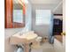 A well-lit bathroom with a pedestal sink, decorative mirror, and a shower-tub combo at 1255 North Nw Ave, Atlanta, GA 30318