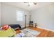 Bright bedroom featuring hardwood floors, neutral walls, and a large window for natural light at 1255 North Nw Ave, Atlanta, GA 30318