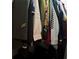 A well-organized closet showcases a variety of hanging clothing at 1255 North Nw Ave, Atlanta, GA 30318