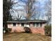 Charming single-story brick home featuring a well-maintained yard and classic white-framed windows at 1255 North Nw Ave, Atlanta, GA 30318