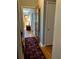 Hallway with hardwood floors, decorative rug, and an open view of the front door at 1255 North Nw Ave, Atlanta, GA 30318
