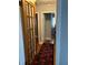 Hallway features wood flooring, light gray walls, and a door with glass panels at 1255 North Nw Ave, Atlanta, GA 30318